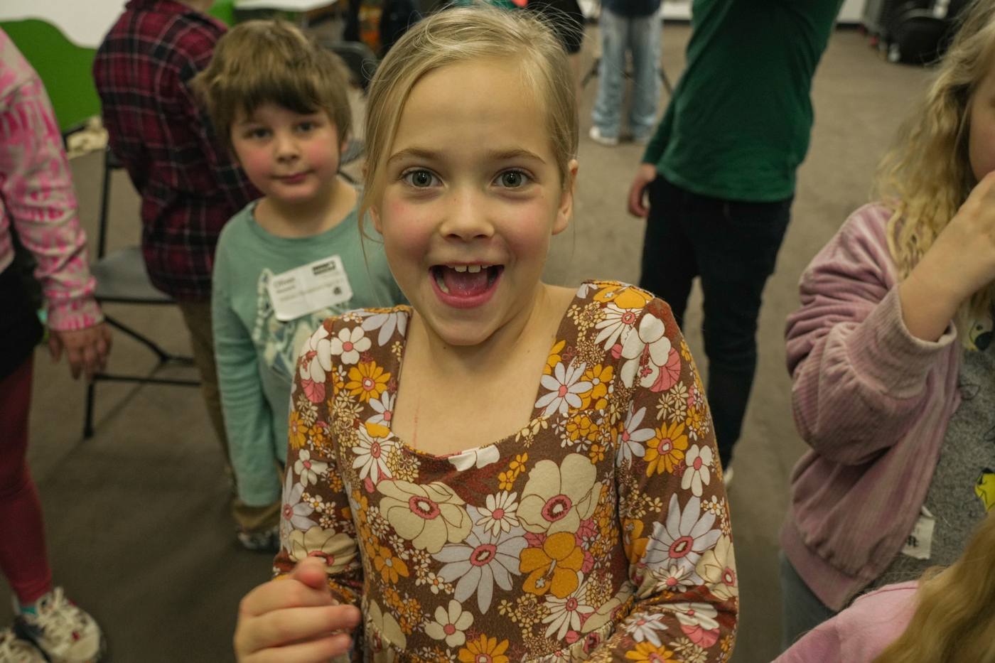 A child smiling at Awaken Kids